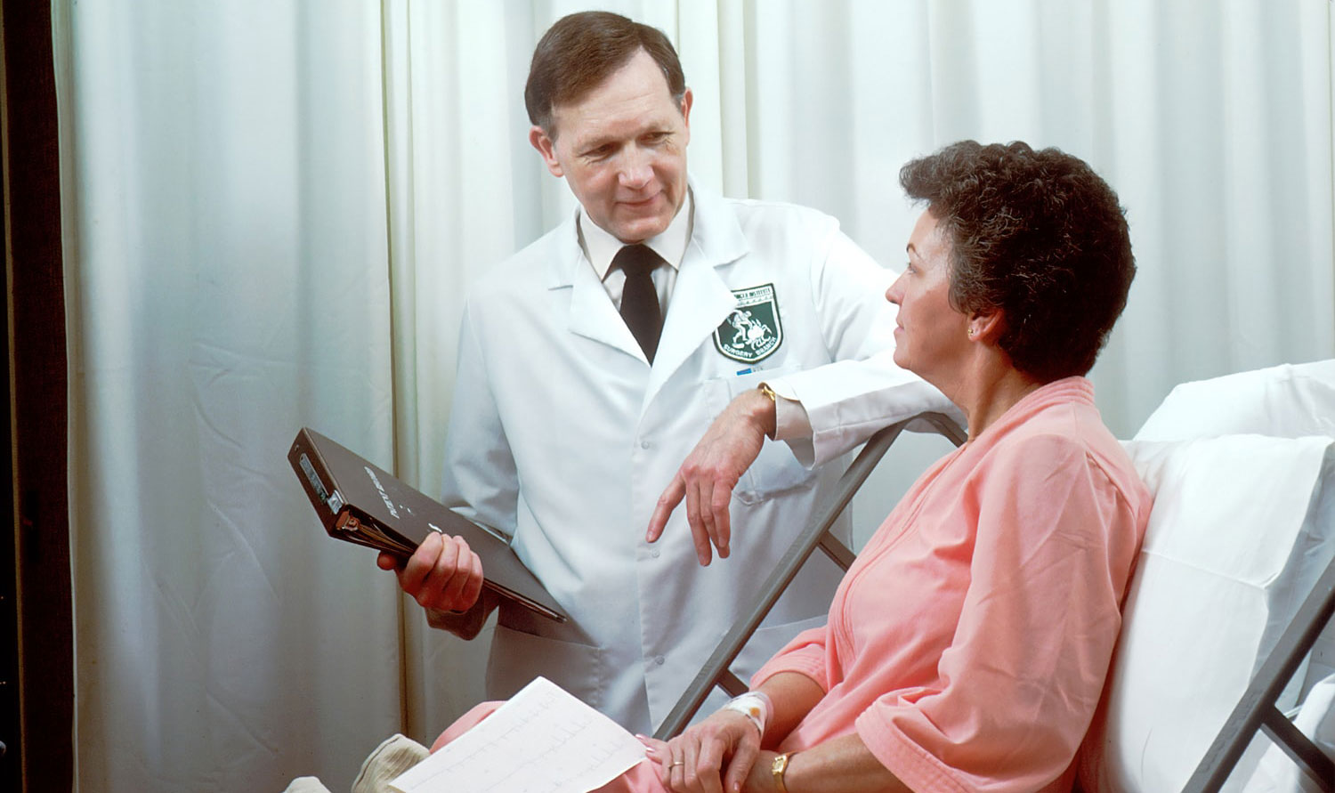 doctor consulting an elderly female patient suffering from constipation
