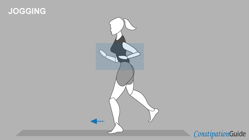 A woman dressed in athletic attire is jogging with her focus directed forward, her head slightly tilted downwards.