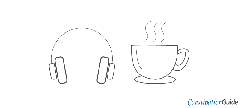 a pair of headphones and a cup of hot tea, suggesting to stimulate motility