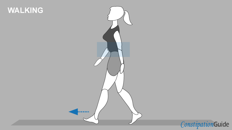A woman dressed in running clothes is warming up before a workout by walking outside.