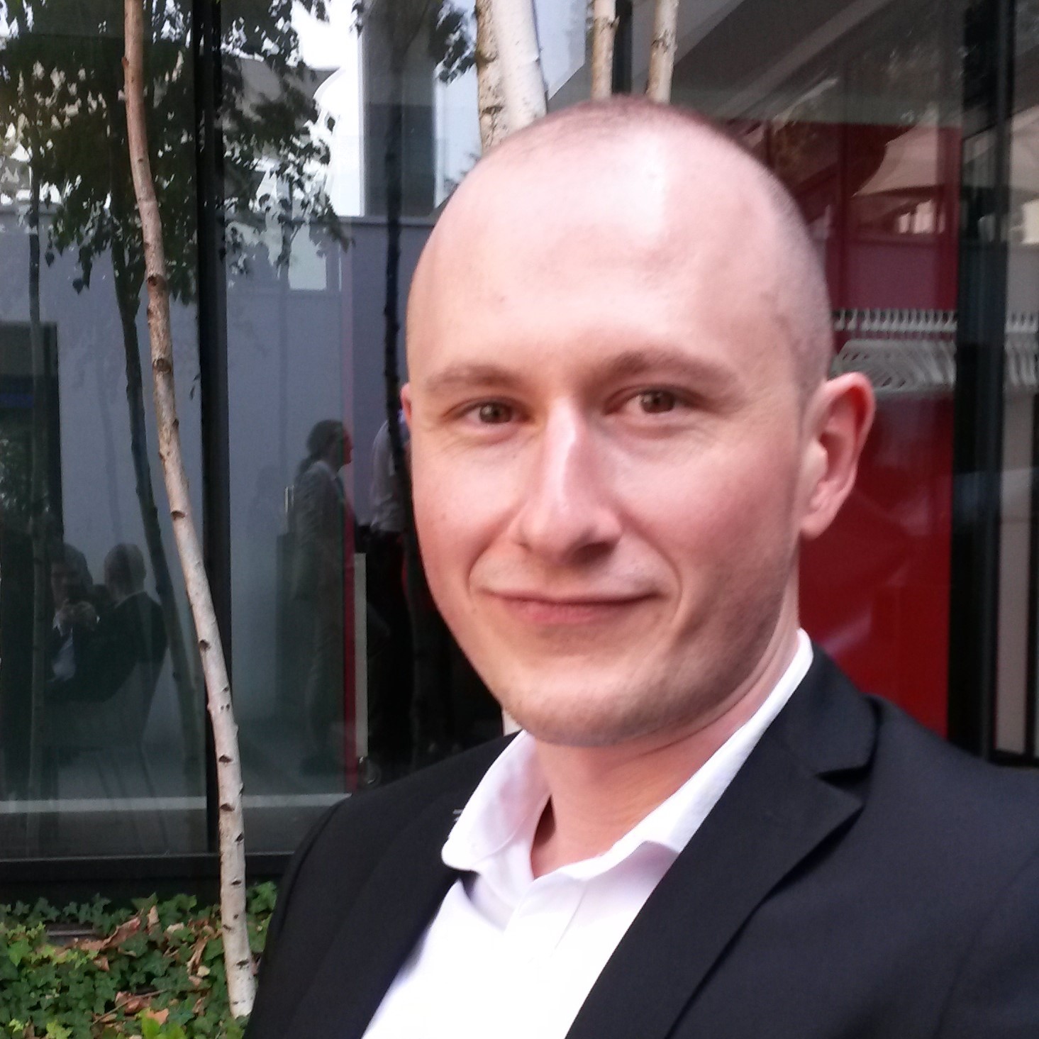 A professional portrait of Sebastian Dan, Senior Editor.